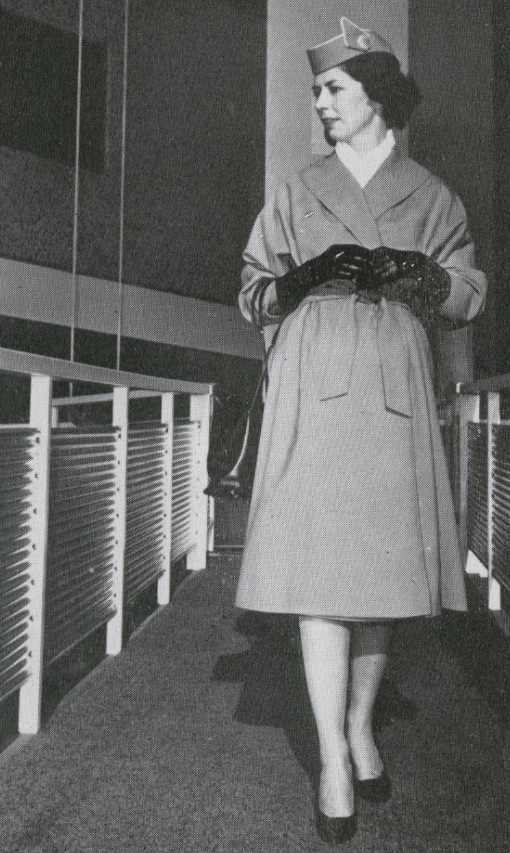 1959 A stewardess in her uniform coat on the jetway at the Pan Am WorldPort in New York.